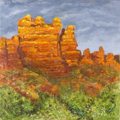 A painting of some rocks and bushes